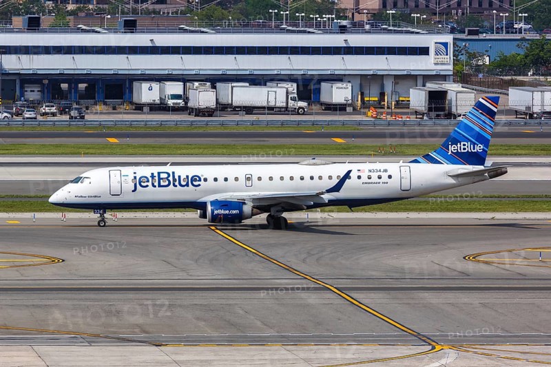 A JetBlue Embraer 190 aircraft with the registration number N334JB at New York JFK Airport in New York, USA, North America