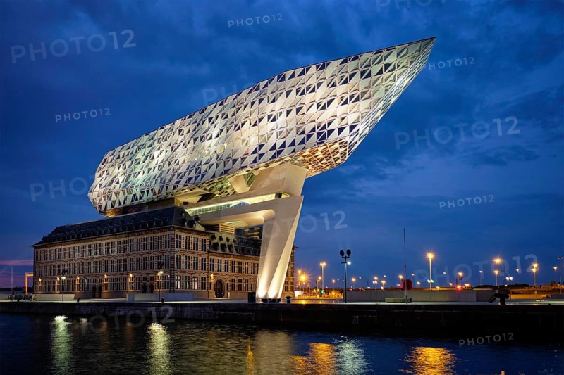 ANTWERP, BELGIUM, MAY 27, 2018: Port authority house (Porthuis) designed by famous Zaha Hadid Architects which was her last project illuminated in the night