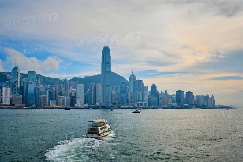 HONG KONG, CHINA, MAY 1, 2018: Hong Kong skyline cityscape downtown skyscrapers over Victoria Harbour on sunset. Hong Kong, China, Asia