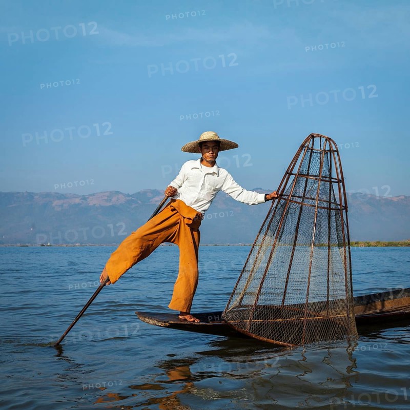 Myanmar travel attraction landmark, Traditional Burmese fisherman at Inle lake, Myanmar famous for their distinctive one legged rowing style