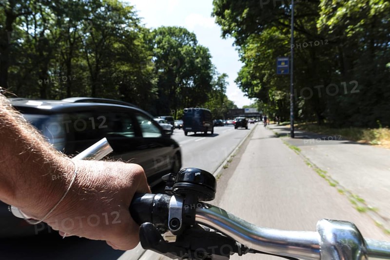 Cycling from a first-person perspective on a cycle path in Cologne, North Rhine-Westphalia, Germany, Europe