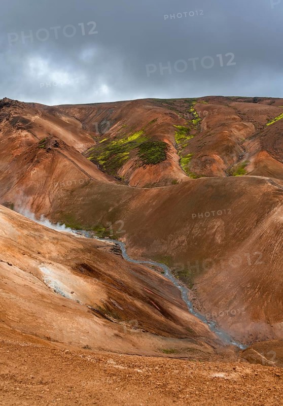 Steaming stream between colourful rhyolite mountains, Hveradalir geothermal area, Kerlingarfjöll, Icelandic highlands, Iceland, Europe