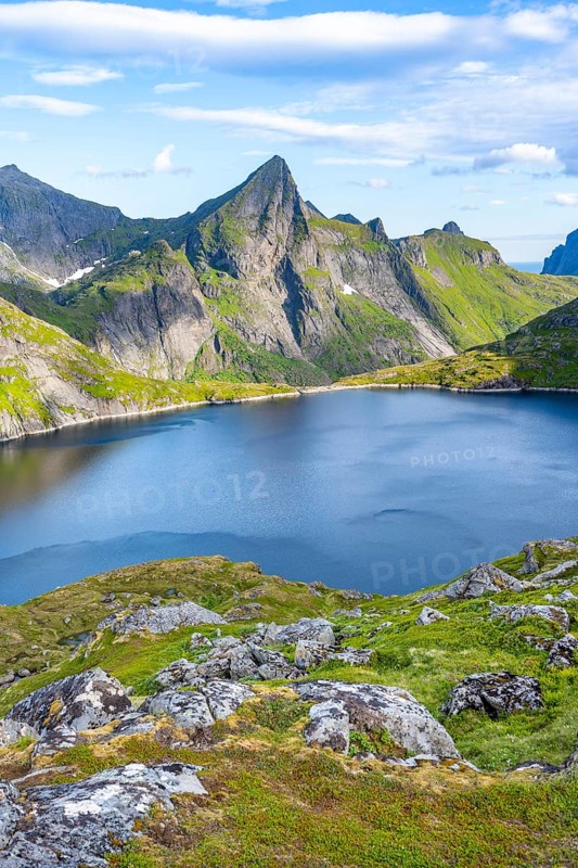 Mountain landscape with lake Tennesvatnet and rocky pointed mountain peak, at sunrise, Moskenesøya, Lofoten, Nordland, Norway, Europe