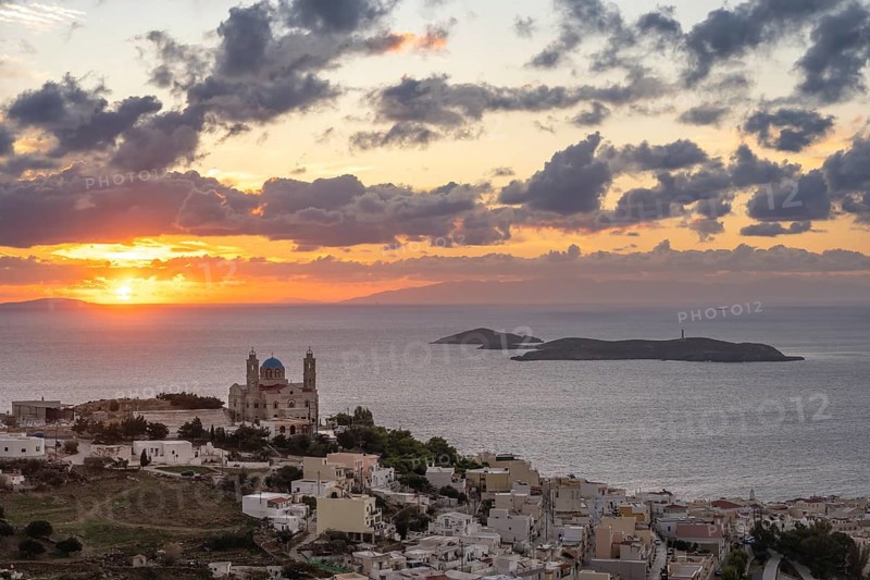 View from Ano Syros to the houses of Ermoupoli with the Anastasi Church or Church of the Resurrection, town view with islands and sea, dramatic cloudy sky at sunrise, Ano Syros, Syros, Cyclades, Greece, Europe