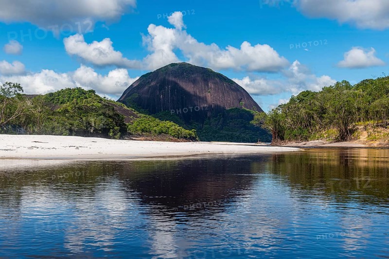 White sand beach before the granite hills of Cerros de Mavecure, Eastern Colombia