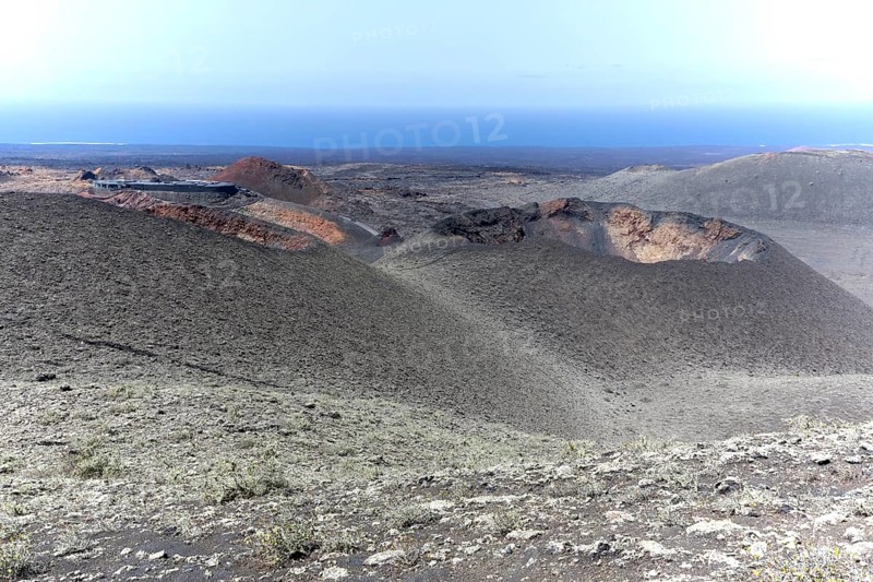 Volcanic landscape with visitor centre in Timanfaya National Park, Lanzarote, Canary Islands, Spain, Europe