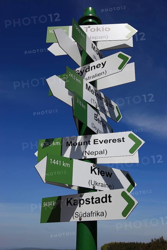 World signpost, Noah's Sails lookout tower at Ellenbogen, 813 m. high mountain of the Rhoen in the district of Schmalkalden-Meiningen, Thuringia, Germany, Europe