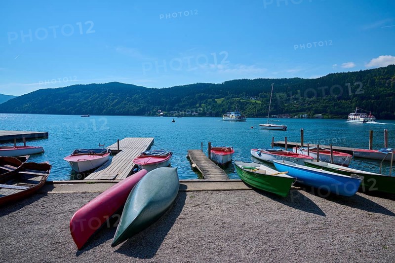 Boats, kayaks, shore, wooden jetty, summer, Lake Millstatt, Millstatt, Carinthia, Austria, Europe