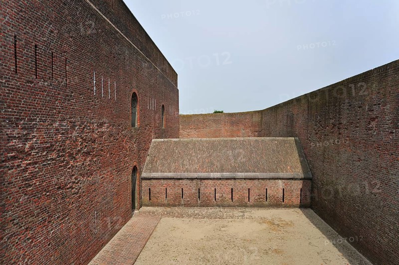 The pentagonal Fort Napoleon with caponier with gun ports and dry ditch in the dunes near Ostend, Belgium, Europe