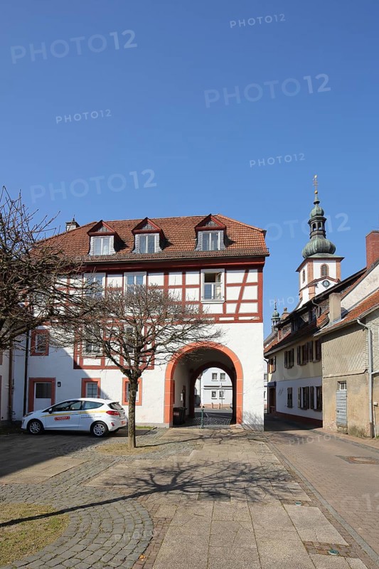 Historic Schleifrashaus, Schleifrashof and church tower, half-timbered house, Salmünster, Bad Soden-Salmünster, Spessart, Hesse, Germany, Europe