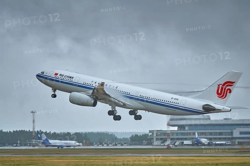 MINSK, BELARUS, JUNE 15, 2018: Air China flight Airbus A330-200 plane taking off on runway in National Airport Minsk