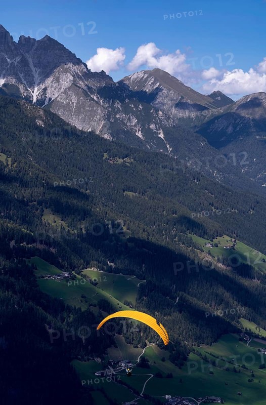 Paraglider in front of alpine panorama, Elfer, Neustift, Stubai Valley, Tyrol, Austria, Europe