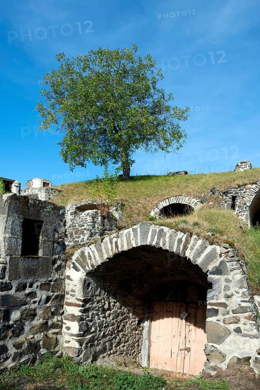 Chateaugay. Wine cellars carved out of the rock. Puy de Dome department. Auvergne Rhone Alpes. France