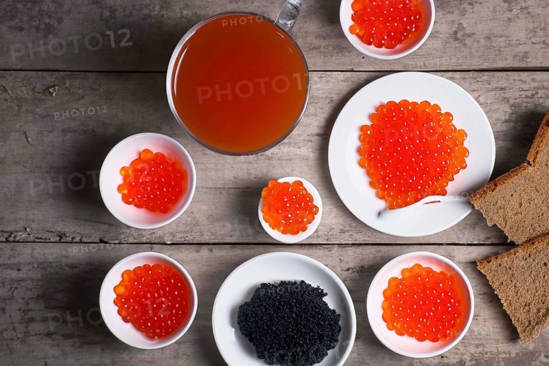 Different kinds of caviar with bread and beverages, AI generated