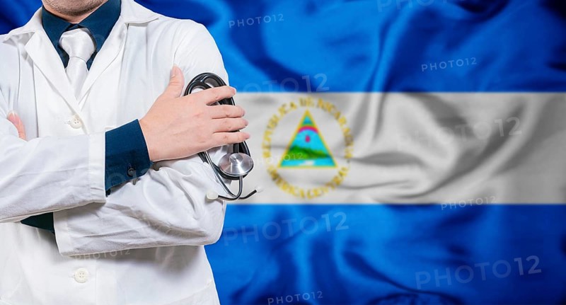 Doctor with stethoscope on flag of Nicaragua. Health and care concept with Nicaragua flag. Doctor with crossed arms on flag of Nicaragua