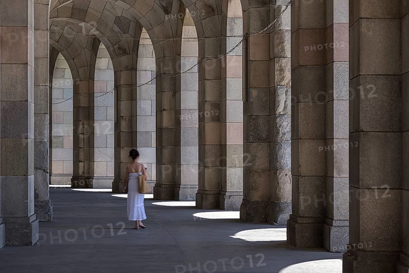 Lady in a white dress in the arcade of the Congress Hall, unfinished National Socialist monumental building on the Nazi Party Rally Grounds, Nuremberg, Middle Franconia, Bavaria, Germany, Europe