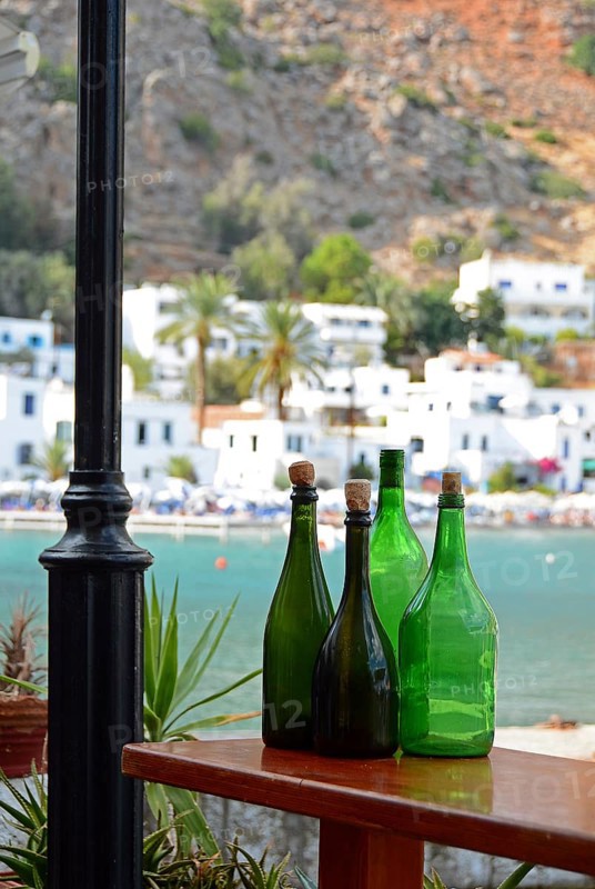 Empty green bottles as decoration, view of Loutro, South Crete, Crete, Greece, Europe