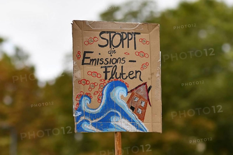 Heidelberg, Germany, 24th September 2021: Sign saying 'Stop emission floods' in German during Global Climate Strike demonstration, Europe