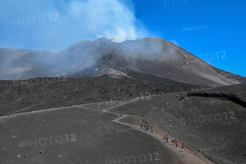 Hikers in the crater landscape of the volcano Etna, summit region, province of Catania, Sicily, Italy, Europe