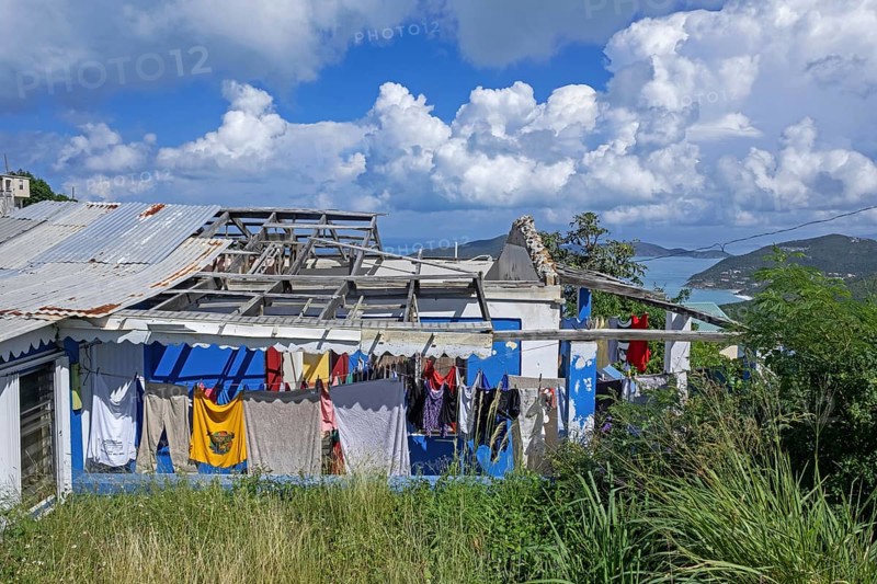 Laundry in front of devastated house, destroyed by Hurricane Irma on the island Tortola, British Virgin Islands, Lesser Antilles in the Caribbean Sea, North America