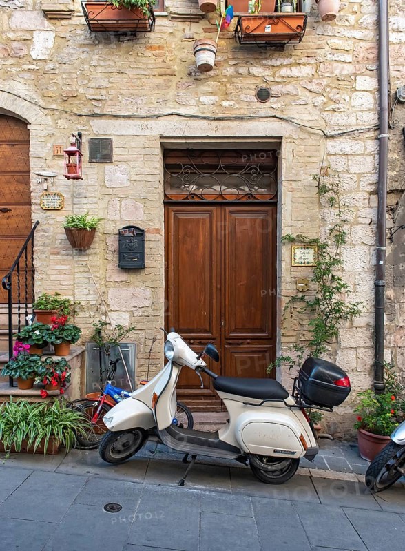 Vespa scooter in the streets of Assisi Old Town, Umbria, Italy, Europe