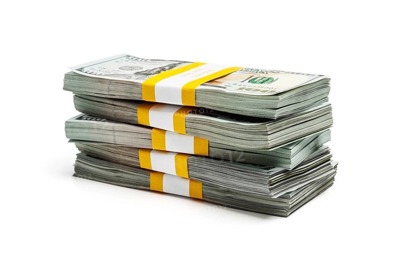 Creative business finance making money concept, stack of bundles of 100 US dollars 2013 edition banknotes bills isolated on white