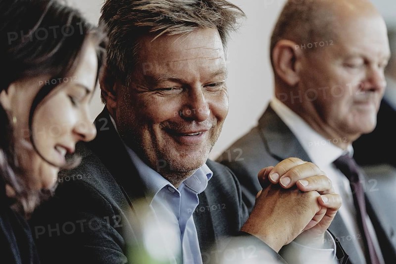 (R-L) Olaf Scholz (SPD), Federal Chancellor, Robert Habeck (Alliance 90/The Greens), Federal Minister for Economic Affairs and Climate Protection and Vice-Chancellor, and Annalena Bärbock (Alliance 90/The Greens), Federal Foreign Minister, pictured during the weekly cabinet meeting in Berlin, 21 August 2024