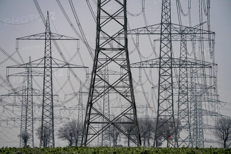 Large power line, 380 KV extra-high voltage lines, near Rommerskirchen, in the fog, winter, North Rhine-Westphalia, Germany, Europe