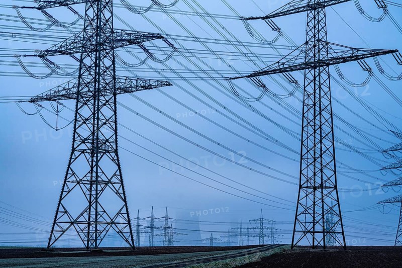 Large power line, 380 KV extra-high voltage lines, near Rommerskirchen, RWE lignite-fired power station Niederaußem in the fog, North Rhine-Westphalia, Germany, Europe