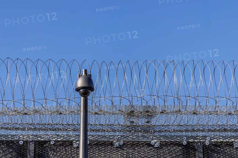 Stammheim prison, JVA. Exterior view with security fence and surveillance camera. Stuttgart, Baden-Württemberg, Germany, Europe