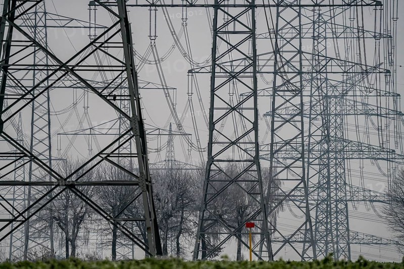 Large power line, 380 KV extra-high voltage lines, near Rommerskirchen, in the fog, winter, North Rhine-Westphalia, Germany, Europe