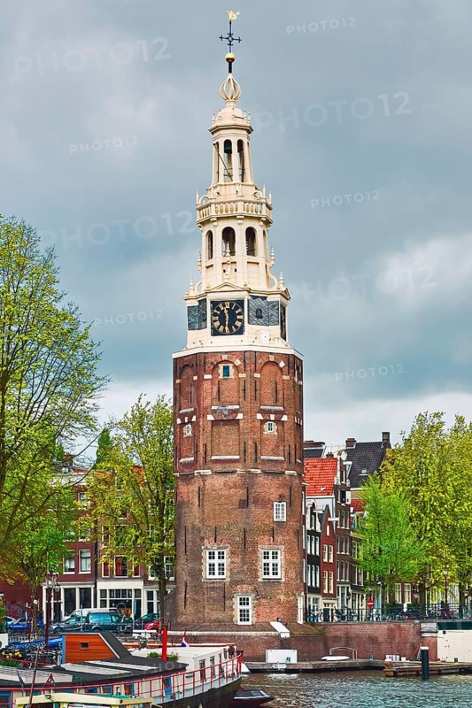 Tower (Montelbaanstoren) on the Bank of the Canal Oudeschans in Amsterdam, Netherlands Amsterdam, Netherlands
