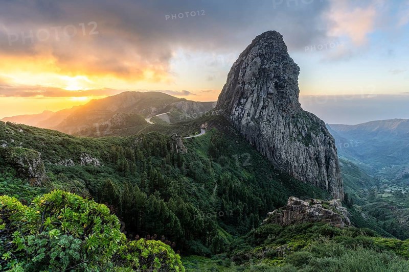 View of the Roque de Agando rock tower, one of La Gomera's landmarks, from the Mirador Roque de Agando. Sunrise, good weather. Monumento Natural de Los Roques, La Gomera, Canary Islands, Spain, Europe