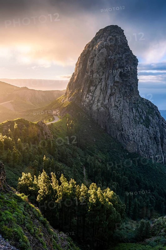 View of the Roque de Agando rock tower, one of La Gomera's landmarks, from the Mirador Roque de Agando. Sunrise, good weather. Monumento Natural de Los Roques, La Gomera, Canary Islands, Spain, Europe