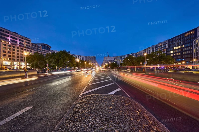 Leipziger Straße with lanterns, buildings and vehicles with traces of light at the blue hour, dusk in Berlin, capital city, independent city, federal state Berlin, Germany, Europe