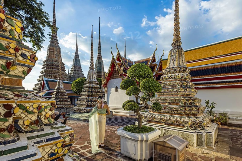 Wat Pho Temple is Bangkok's oldest Buddhist monastery near the Grand Palace. Four chedis are among the most precious in Bangkok. Temple dancer. Bangkok, Thailand, Asia