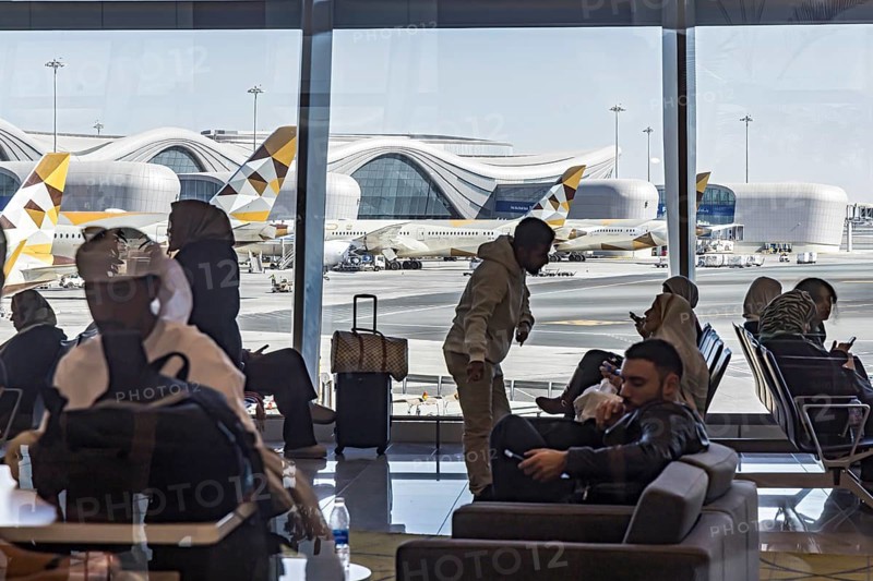 Abu Dhabi Airport. View of the modern terminal with Etihad airline aircraft from the gate. Abu Dhabi, United Arab Emirates, UAE, Asia