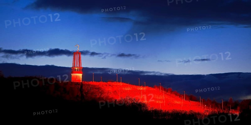 Artwork Illuminated at night with red illuminated slagheap Rheinpreussen by Otto Piene, Moers, Ruhr Area, North Rhine-Westphalia, Germany, Europe