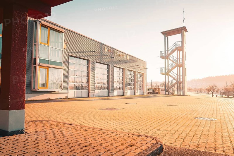 Modern fire station with training tower, illuminated by the sun, Althengstett, district of Calw, Germany, Europe
