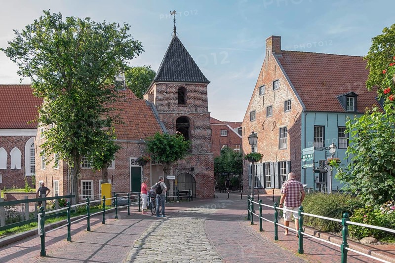 Church tower and old brick buildings, centre of Greetsiel, Krummhörn, East Frisia, Lower Saxony, Germany, Europe