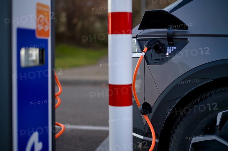 E-vehicle Hyundai IONIQ 5 at EnBW charging station for electric cars, charging station, e-filling station, e-mobility, charging cable leads into e-car, charge level indicator, Stuttgart, Baden-Württemberg, Germany, Europe
