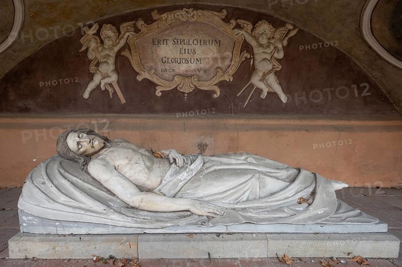 Jesus on the deathbed, sculpture in an outside chapel on the east choir of the late Gothic St George's Church, Dinkelsbühl, Bavaria, Germany, Europe