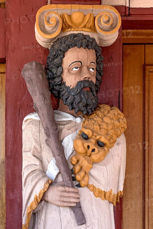 Atlant, figure of the god Hercules, colourfully painted carving on the portal to the town hall, historic Renaissance half-timbered house, old town, Hadamar, Limburg-Weilburg, Westerwald, Hesse, Germany, Europe