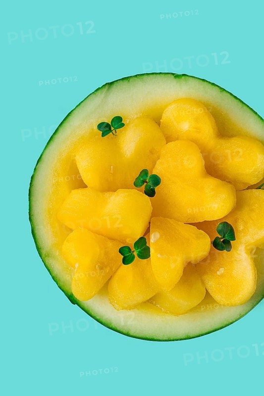 Yellow mini watermelon, Sliced in the shape of a heart, top view, no people, close-up, selective focus