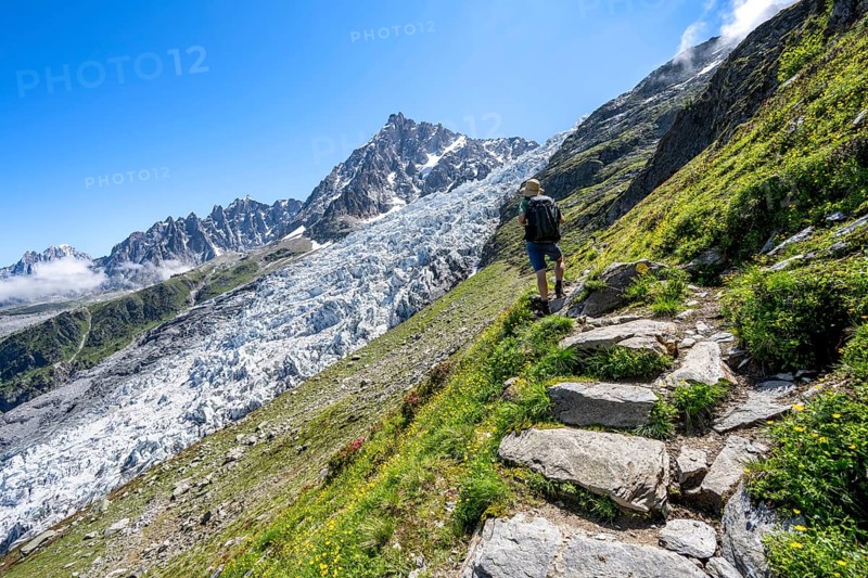Hiking on the trail to La Jonction, Glacier des Bossons, behind the summit of the Aiguille du Midi, Chamonix, Haute-Savoie, France, Europe
