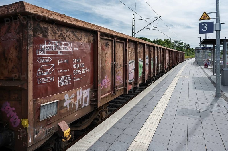 Goods train passes through the railway station in Haßfurt, Lower Franconia, Bavaria, Germany, Europe