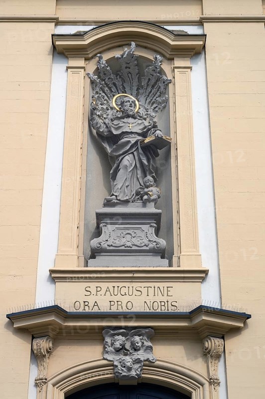 Figure of St Augustine in a niche above the entrance portal of St Augustine's Church, Dominikanerplatz, Würzburg, Lower Franconia, Bavaria, Germany, Europe