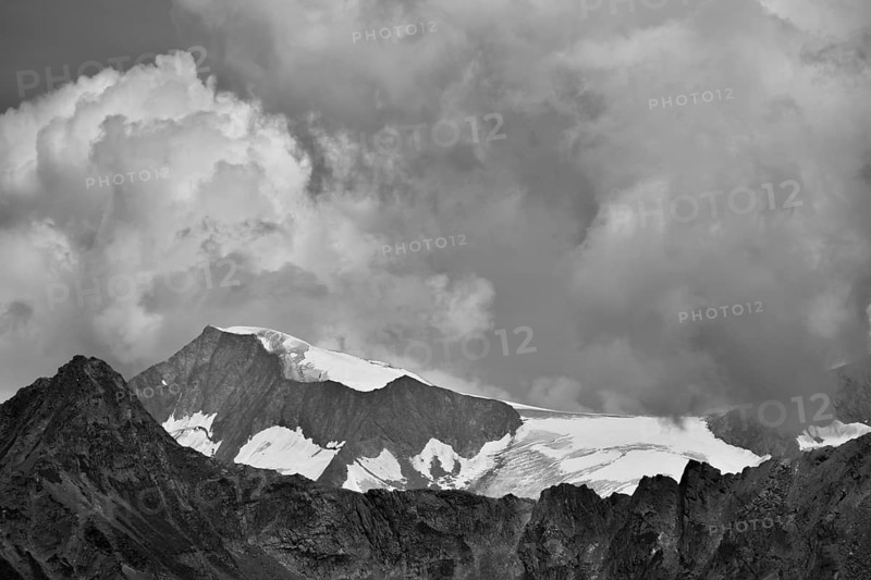 View from the south to the Großvenediger with the Mullwitzkees glacier and dramatic clouds, black and white, East Tyrol, Austria, Europe