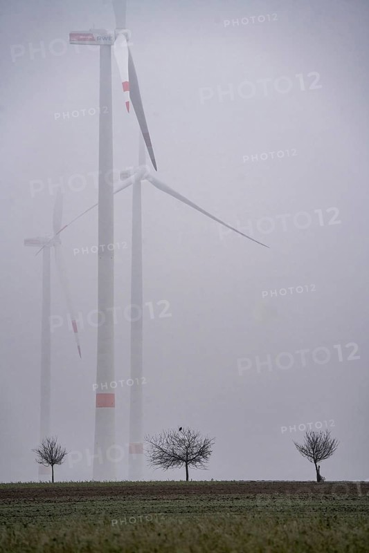 Wind farm in fog, dark doldrums, no wind no direct sunlight, in the Rhenish lignite mining area, south of the Garzweiler open-cast mine near Bedburg, North Rhine-Westphalia, Germany, Europe