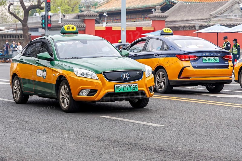 Taxis as electric cars of the Chinese car brands BAIC Motor and Beijing Electric Mobility Transport in Beijing, China, Asia